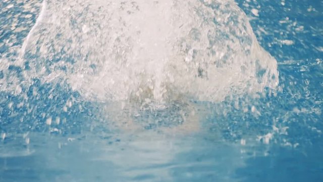 A female swimmer gets closer to the camera.  