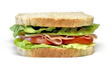 Delicious ham and cheese sandwich, isolated on white background. Gourmet toast or sandwich with lettuce, tomato, chess and turkey. Whole grain sandwich, healthy eating.