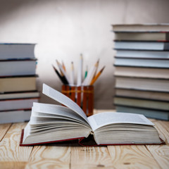 Textbooks and books on a wooden table