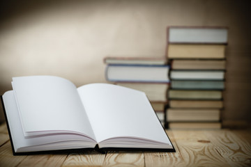 Textbooks and books on a wooden table