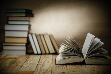 Textbooks and books on a wooden table
