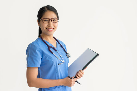 Positive nurse working with medical documents