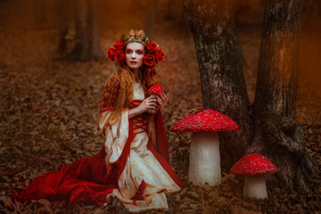 Fototapeta na wymiar Woman in red medieval dress
