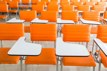 classroom with many orange armchairs