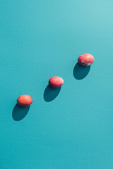 top view of red shabby easter eggs, on blue