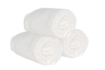Fototapeta na wymiar Three clean spa towels rolls on the white isolated backgtound