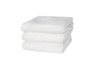 Fototapeta na wymiar Stack of white plush hotel towels isolated on white background