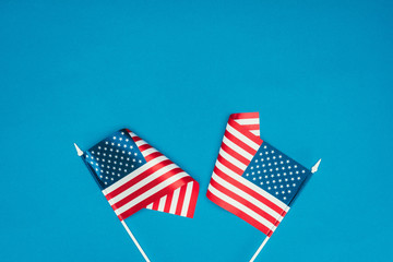 top view of american flags isolated on blue, presidents day concept