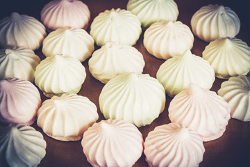 Sweet spiral white meringues. Selective focus.