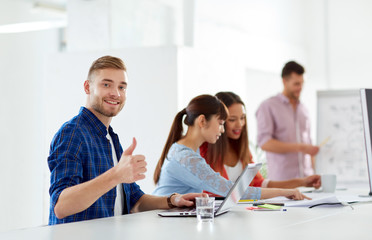 Fototapeta premium happy man with creative team at office conference