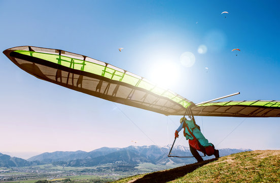 Hang glider launch from top of hill