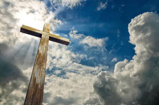 Cross against the sky. Happy Easter. Christian symbol