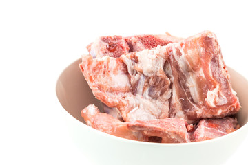 raw pork ribs on white  dish isolated
