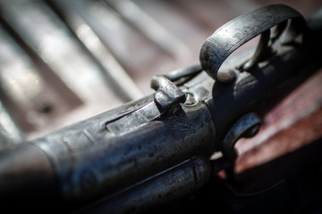 A vintage shotgun with intricate inlays