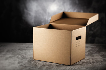 Cardboard box on grey background