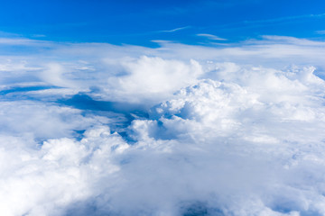 Fluffy White Clouds from Above. clouds and sky
