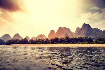 Color toned picture of a scenic sunset over Li River (Li Jiang) near Xingping, China.
