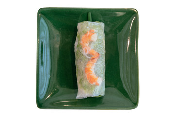 Isolated top view of Vietnamese Fresh Spring Rolls including lettuce and boiled shrimp served in green plate at the restaurant in Hanoi, Vietnam.