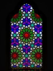 Islamic window, colored stained glass window of a mosque with a traditional pattern. A color shade from the stained glass. 3D rendering.
