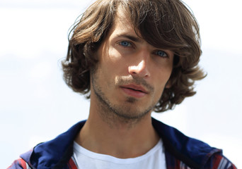 portrait. stylish guy in a plaid shirt. close-up.