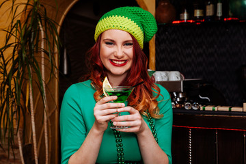 young celebrate Patrick day fun bar carnival headgear girl man beer cocktail green clothes hat smile beautiful