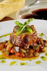 Rabbit stuffed with pistachio, asparagus and veal accompanied by ratatouille.