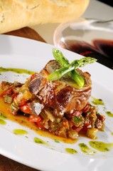 Rabbit stuffed with pistachio, asparagus and veal accompanied by ratatouille.