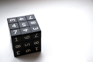 black Sudoku cube with numbers