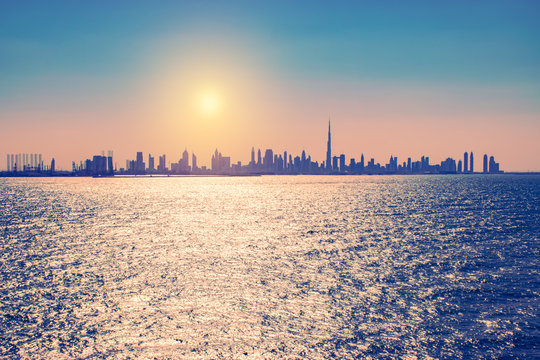 Dubai skyline at sunrise.