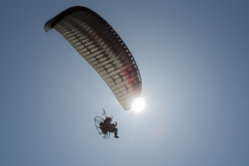 A paraglider in the sky