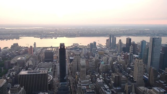 NEW YORK CITY - JUNE 2013: Aerial view of city skyline at sunset. The city attracts 50 million tourists every year