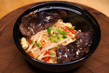 Restaurant dish noodles with bits of beef