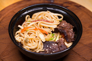 Restaurant dish noodles with bits of beef