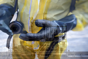 Double exposure of  Rescuers in a chemical suit wearing chemical gloves and chemical plant industry .