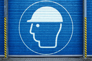 Rolltor mit Gebotszeichen Kopfschutz benutzen Piktogramm Graffiti