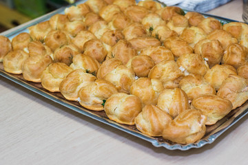 Baked flour confectionery with stuffing on a metallic tray