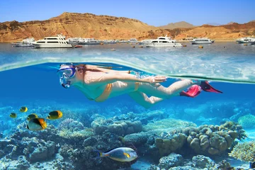 Plexiglas foto achterwand Young woman at snorkeling in the tropical water © Patryk Kosmider