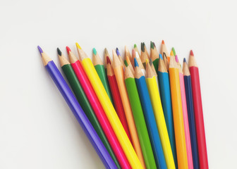 Colored pencils on a white background.