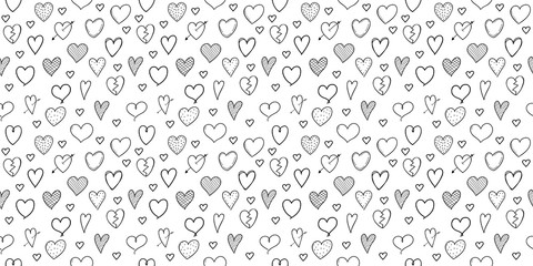 Seamless pattern with hand drawn hearts - concept of a wrapping paper. Vector.