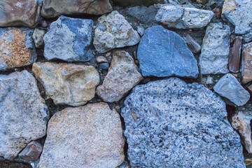 Several colored stones in the soil