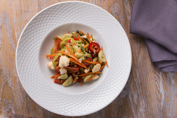 salad with fresh vegetables carrot pepper tomato cauliflower onion greens