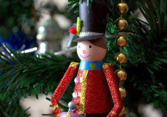 Beautiful, bright, colorful decoration for the house and Christmas trees is a figurine of a soldier in antique form.  Christmas and New Year is a joyful and cheerful holiday.