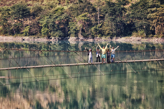 Group of Tourists on a Suspension Bridge, Nepal