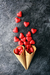 Valentine day candy with red hearts and cones