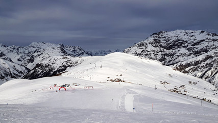 Winter holiday in the Alps mountains under blue sky