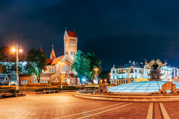 Minsk, Belarus. Night View Church Of Saints Simon And Helen Or Red Church