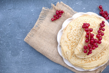 Thin sweet pancakes. traditional Russian food in the spring. Festive treat. Homemade breakfast. Free space for text or a postcard.