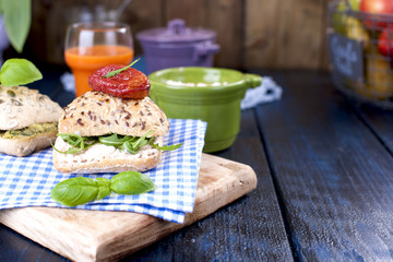 Sandwiches for lunch or breakfast with avocado paste and soft cheese. Juice. Free space for text. A copy of a sandwich.