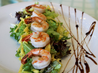 appetizing prawns with greens and cheese close-up