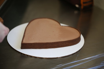 Cake in the shape of heart on Valentine's Day. Close-up